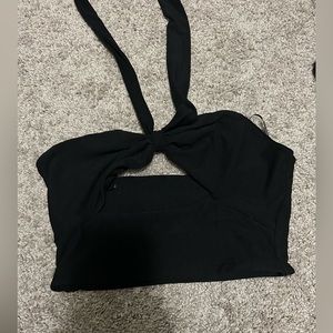 Size small, black crop top with a tie around neck.